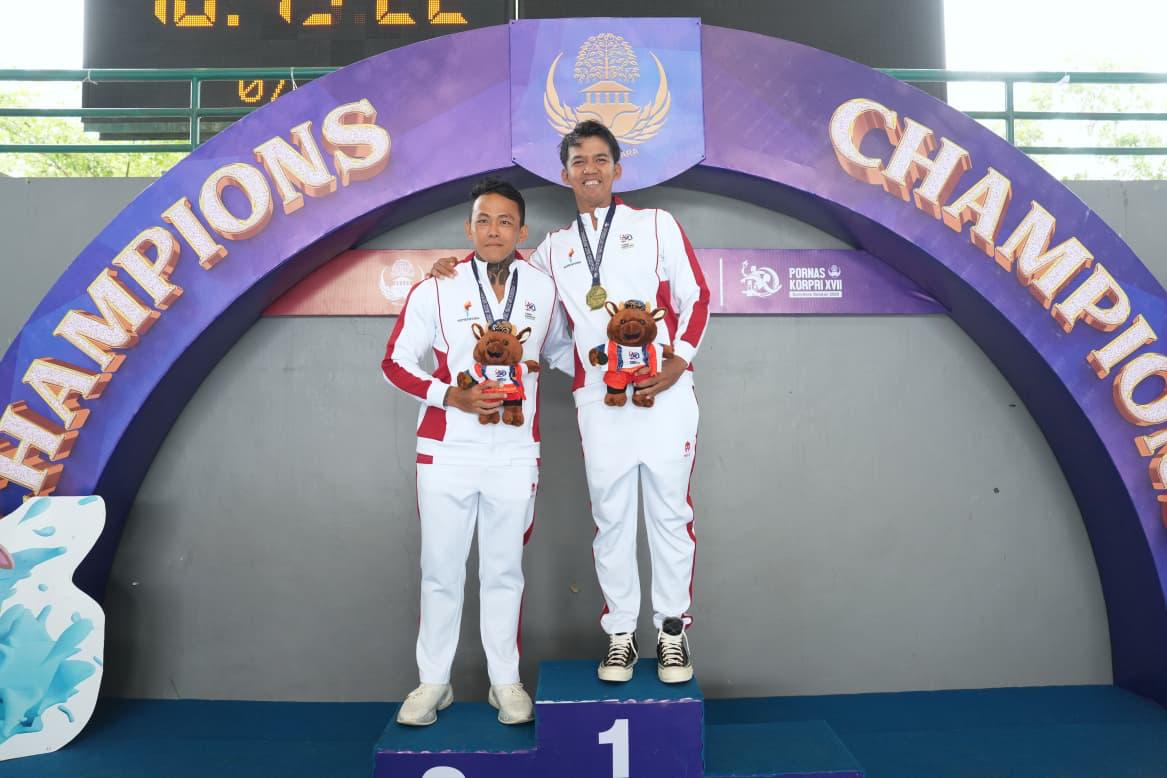 Triady Fauzi Sidiq sukses menambah medali emas setelah mencatatkan waktu tercepat 57,51 detik.(foto:Herry/kemenpora.go.id)